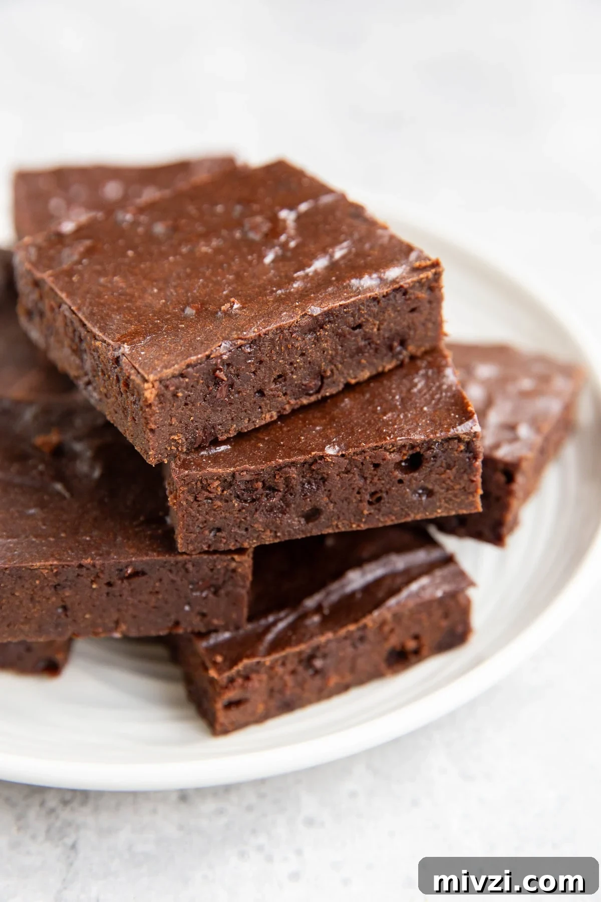 Plate of cottage cheese brownies cut into slices.