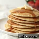 syrup dripping down stack of pancakes made without milk