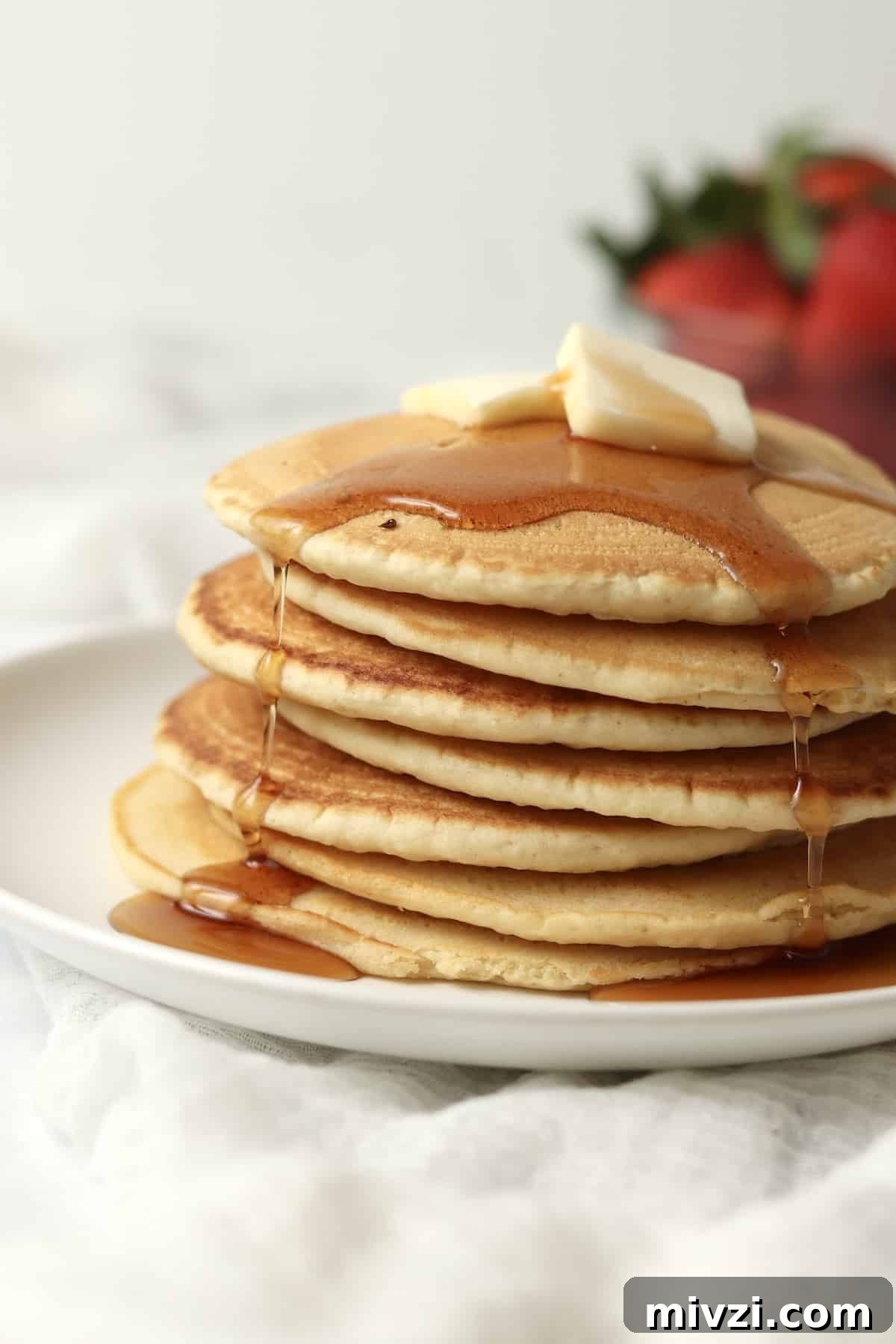 syrup dripping down stack of pancakes made without milk
