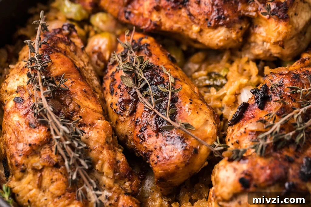 29 Cozy One-Pot Fall Dinners That Cut the Cleanup 2 Close up view of a baked chicken and rice dish.