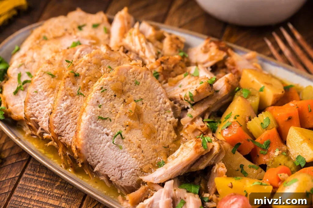 29 Cozy One-Pot Fall Dinners That Cut the Cleanup 15 A pork loin with vegetables on a plate.