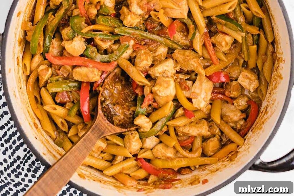 29 Cozy One-Pot Fall Dinners That Cut the Cleanup 19 Chicken fajita pasta in a blue pot.