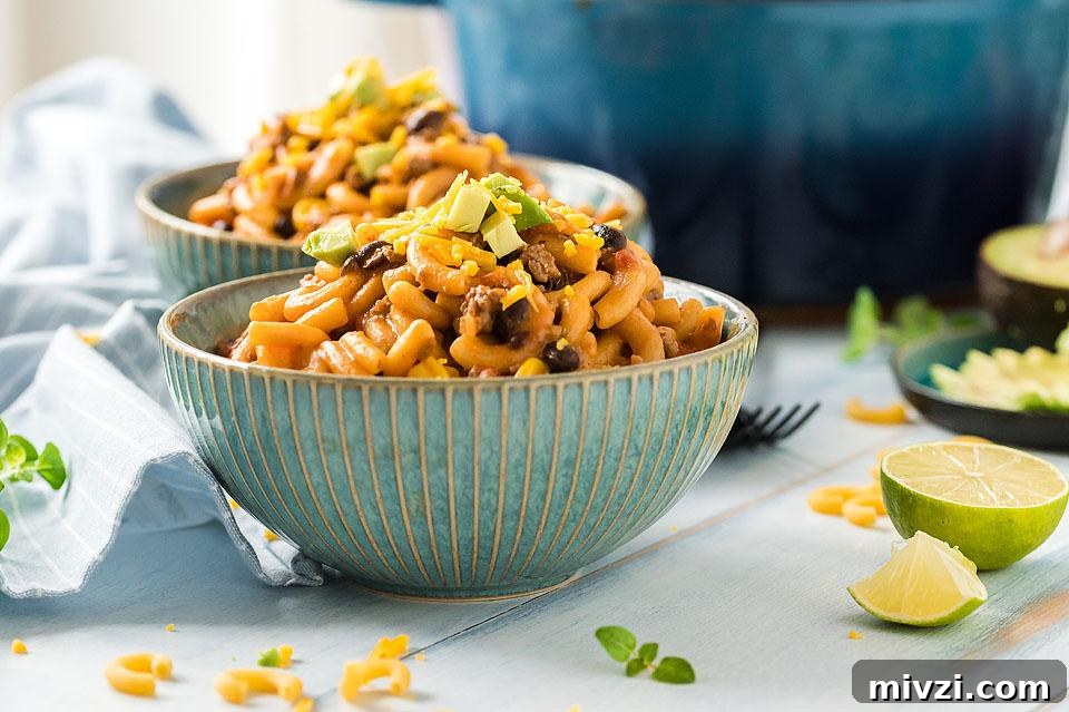 29 Cozy One-Pot Fall Dinners That Cut the Cleanup 3 On pot taco mac and cheese in pot.