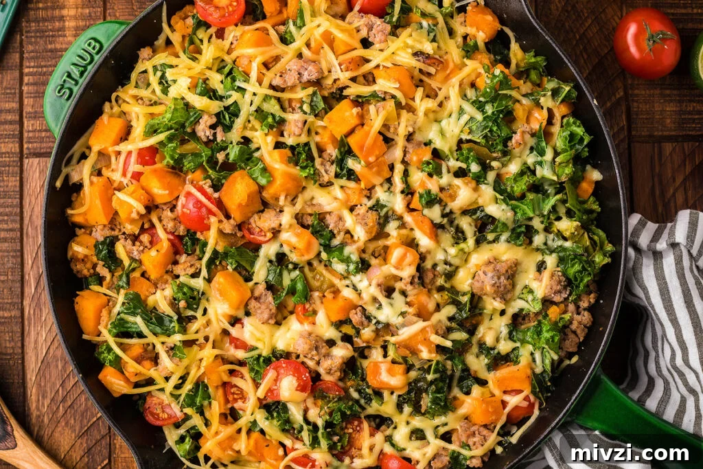 29 Cozy One-Pot Fall Dinners That Cut the Cleanup 5 A cast iron skillet with a turkey, kale and sweet potato dish.