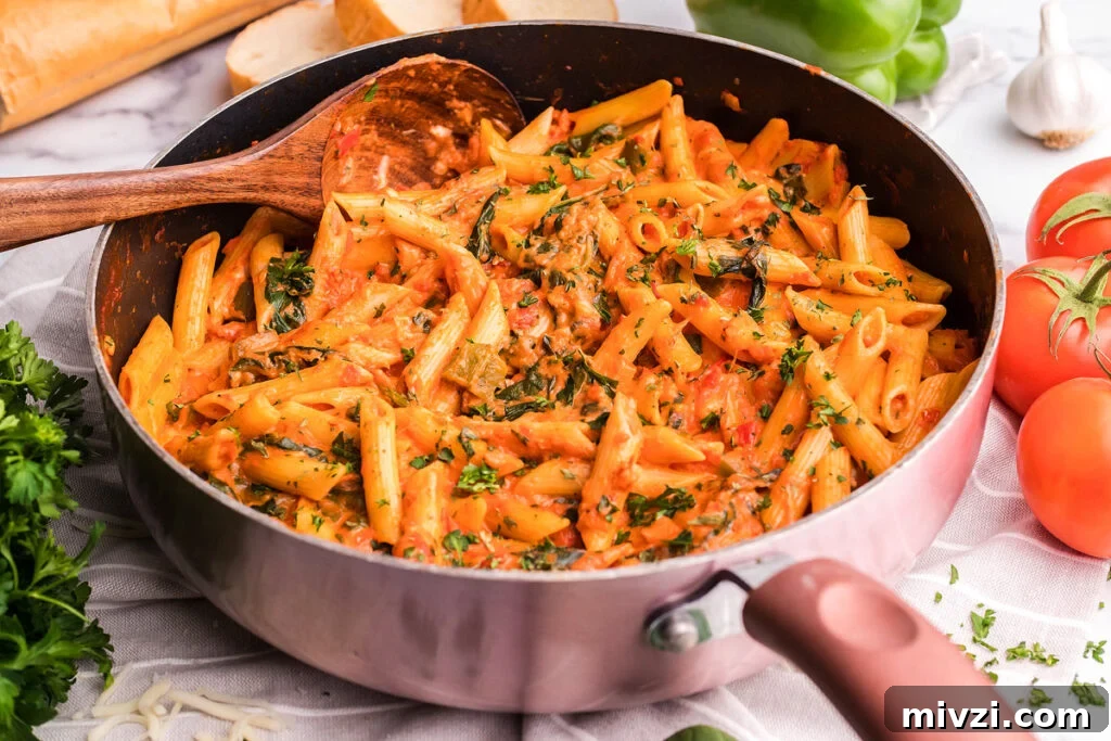 29 Cozy One-Pot Fall Dinners That Cut the Cleanup 6 Overhead view of penne pasta with a rosa sauce in a pan.