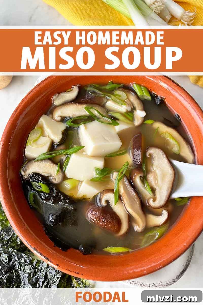 Vertical image of a red bowl filled with broth with mushrooms, tofu, and seaweed, with text on the top and bottom of the image.